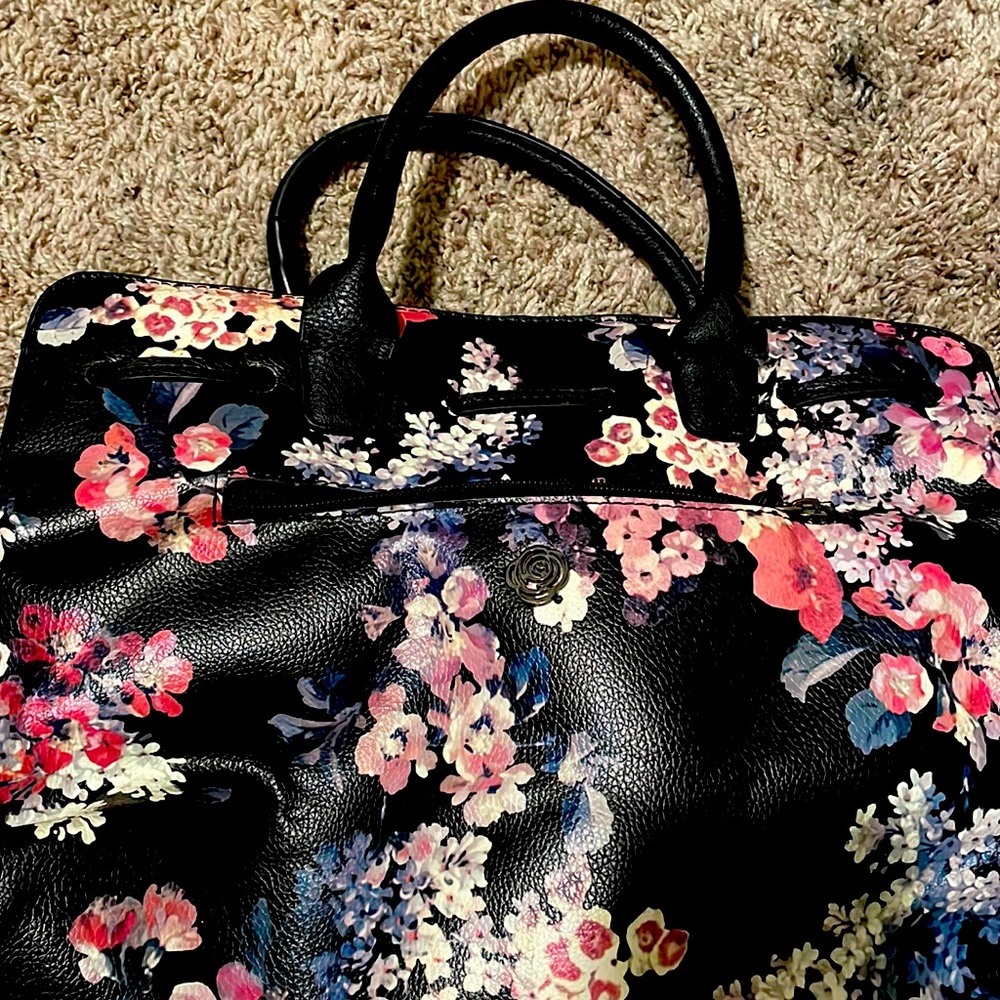 Floral rose patterned medium sized hand bag with extra shoulder strap inside